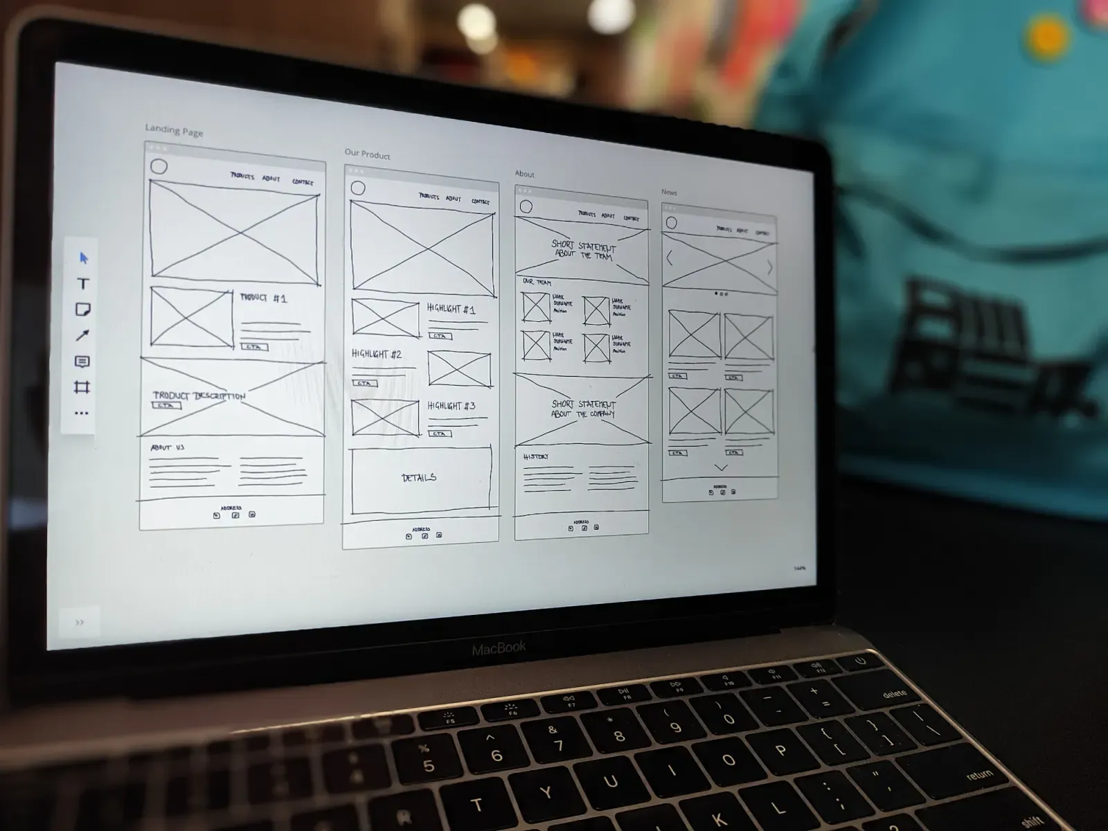 Placeholder: a laptop showing wireframe sketches of a website.